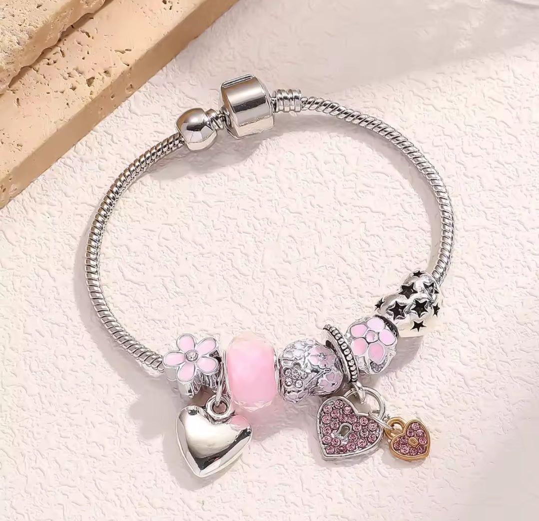 Pink and silver colored charm bracelet
